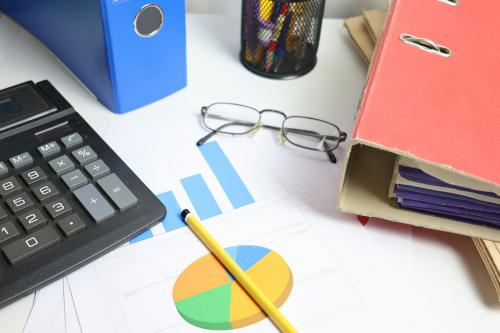 Glasses, calculator, notebook
